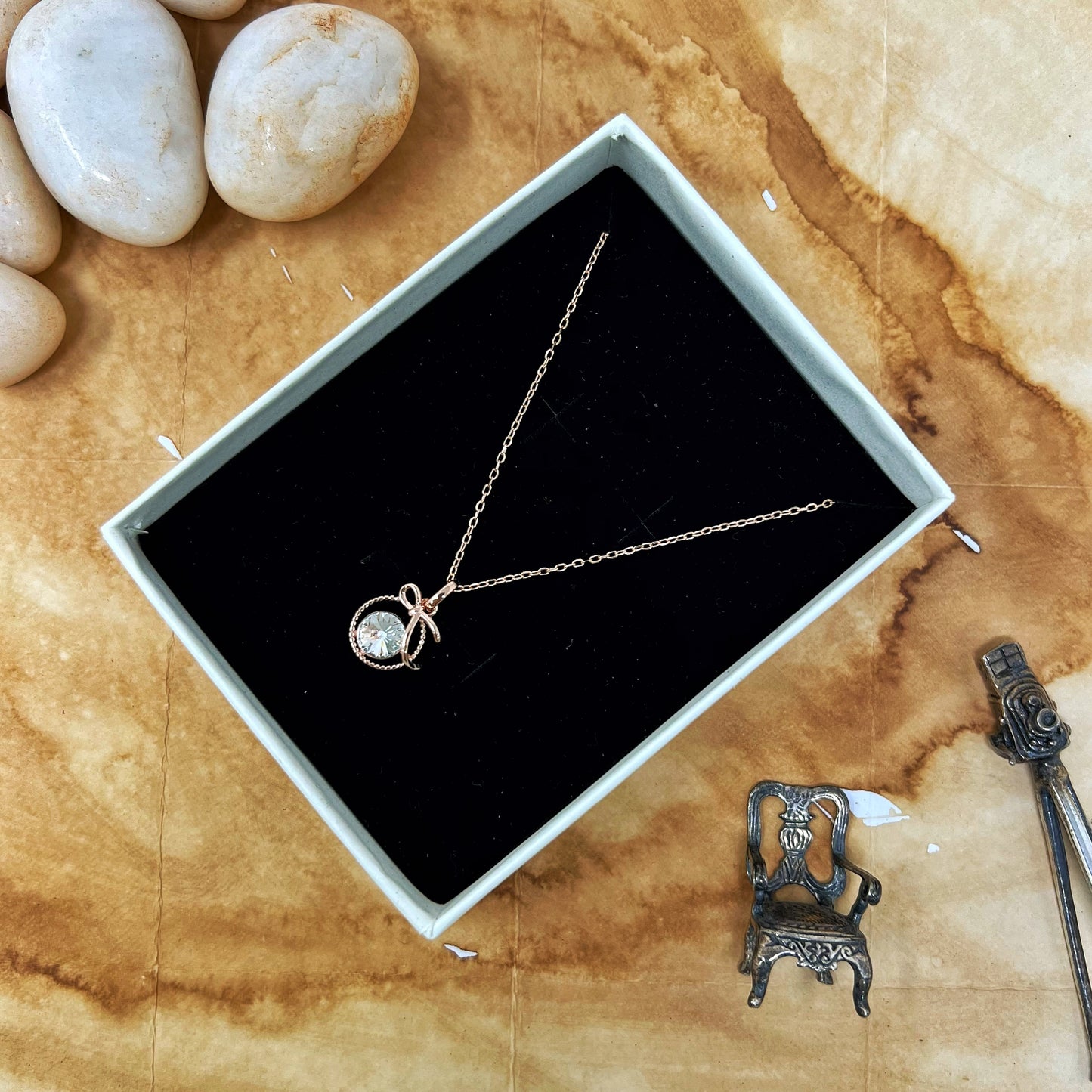 Rose Gold Solitaire Bow Chain And Locket
